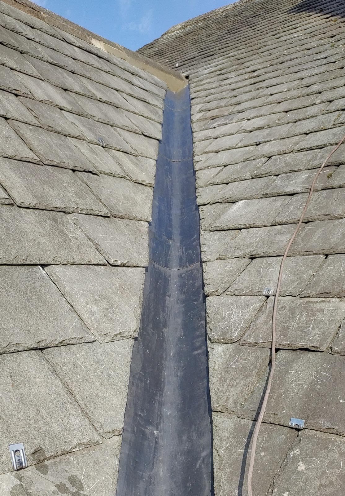 Lead flashing on slate roof